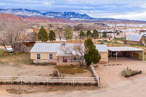 View of subject property with a mountain backdrop