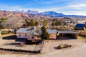 View from above of property with a mountain backdrop
