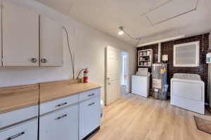 Oversized laundry room with storage.