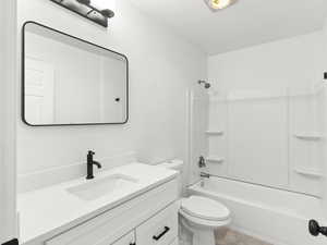 Full bath featuring vanity and bathtub / shower combination
