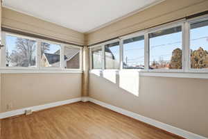 2nd Bedroom with baseboards and light wood finished floors