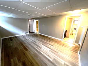 7' ceiling with light wood finished floors.