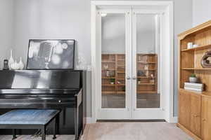 Office off of entry with glass french doors