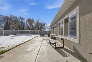 Fenced backyard featuring a patio