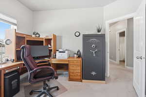 Guest bedroom with light colored carpet and baseboards