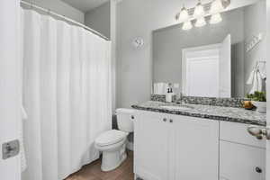 Guest Bathroom featuring vanity and curtained shower