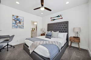 Bedroom featuring a ceiling fan, carpet floors, ensuite bathroom, and recessed lighting