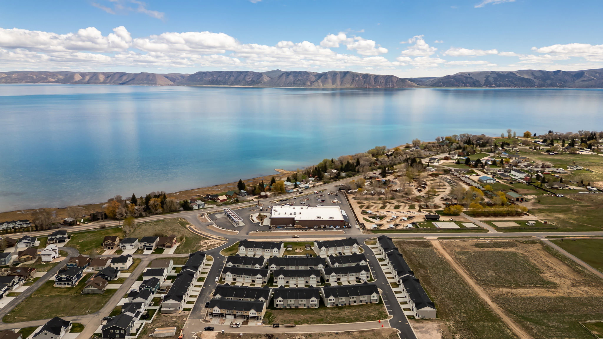 Aerial view of residential area with a water and mountain view
