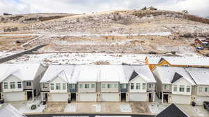 Aerial view of residential area and additional recreational vehicle parking on the hillside