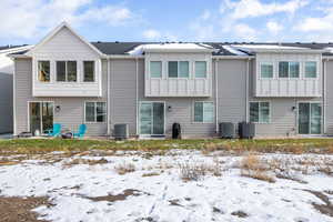 back of property featuring board and batten siding