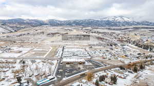 Aerial overview of property's location with a mountainous background