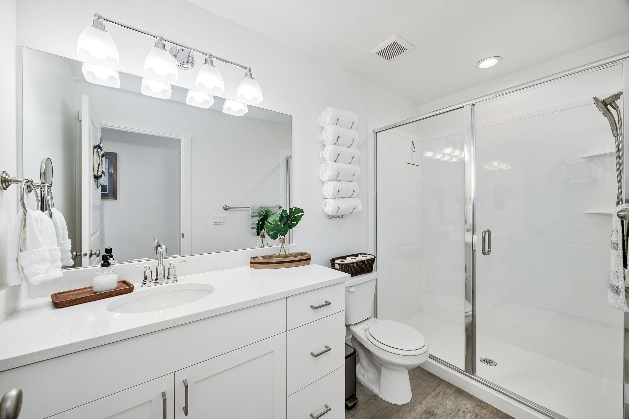 Full bathroom with vanity, shower, light wood-style floors, and recessed lighting