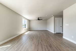 Unfurnished room with light wood finished floors, ceiling fan, and recessed lighting