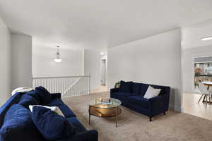 Tiled living area featuring carpet