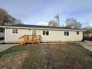 Single story home featuring crawl space and a shingled roof