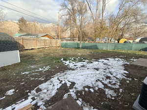 View of fenced backyard