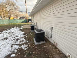 View of home's exterior with a cooling unit and a patio area