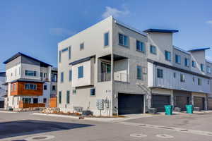 View of property featuring a residential view and a garage