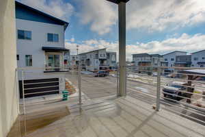 Wooden deck with a residential view