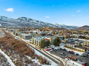 Snowy aerial view featuring a mountain view