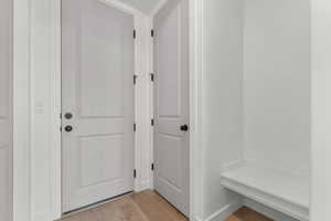 Mudroom with light wood-type flooring