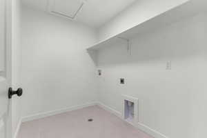 Laundry area with hookup for a washing machine, hookup for an electric dryer, and light tile patterned floors