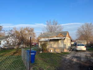 View of side of property featuring board and batten siding and a shingled roof