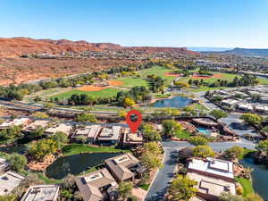 Aerial view of residential area featuring a water and mountain view