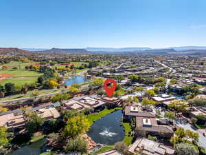 Aerial perspective of suburban area with a water and mountain view