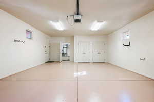 Garage with secured water heater and a garage door opener