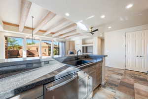 Kitchen featuring tile countertops, dishwasher, decorative light fixtures, recessed lighting, and a ceiling fan