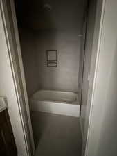 Full bath featuring a bathtub and vanity