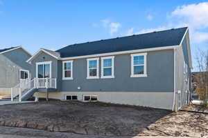 View of front of property with roof with shingles