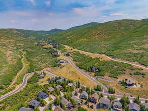 View of property location featuring a mountain backdrop and nearby suburban area