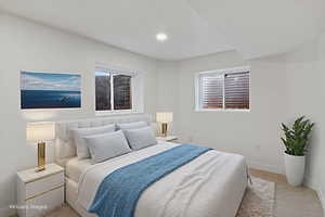 Carpeted bedroom with baseboards