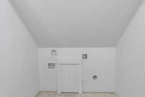 Laundry room with washer hookup, electric dryer hookup, and a textured ceiling