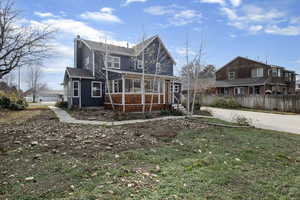 Back of house with a chimney