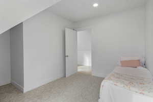 Bedroom with carpet flooring and recessed lighting