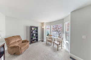 Living room with carpet and baseboards