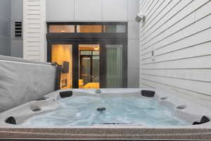Property entrance featuring a hot tub