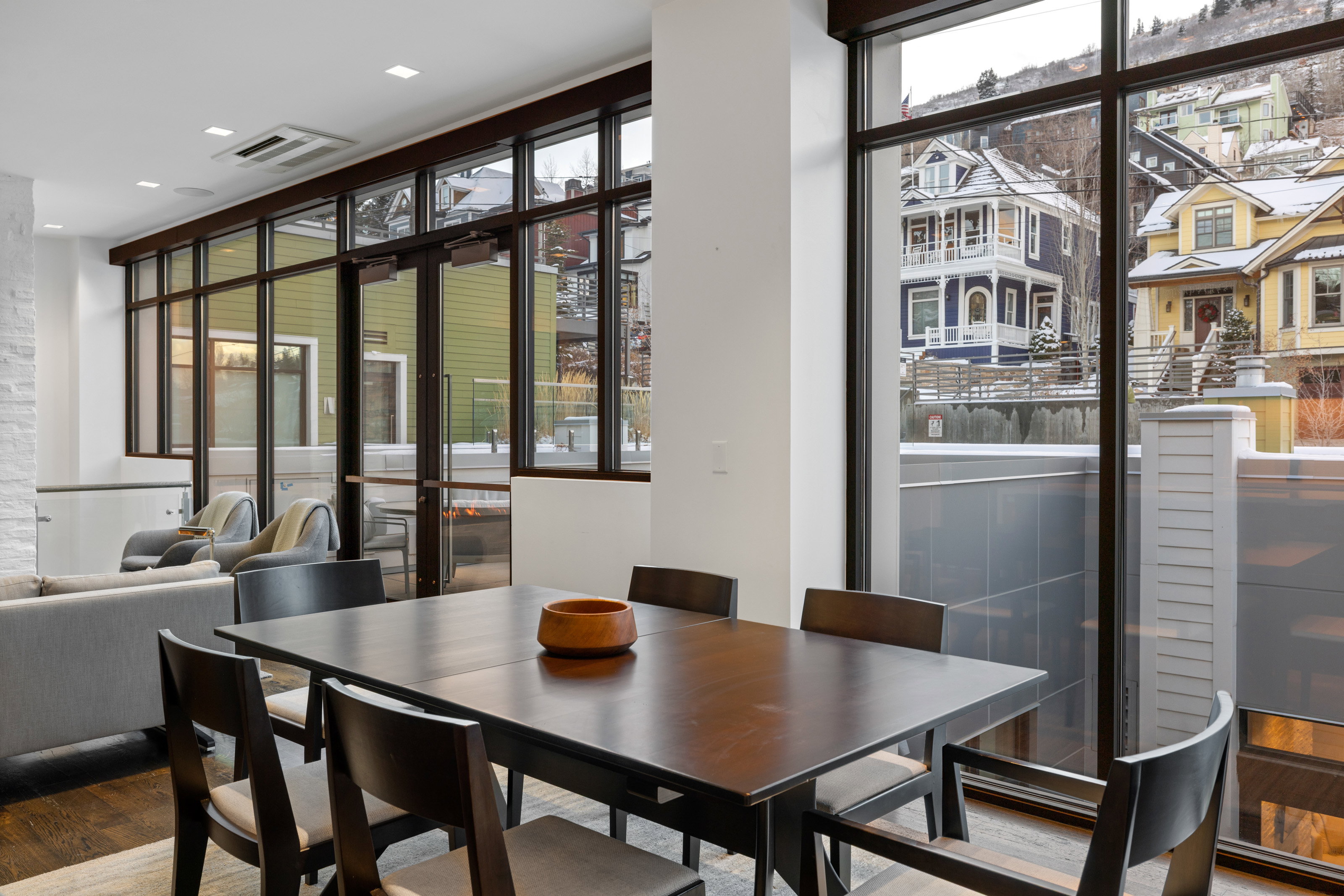 Dining area with plenty of natural light, wood finished floors, and recessed lighting