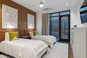 Bedroom with access to outside, wood finished floors, ceiling fan, cooling unit, and french doors