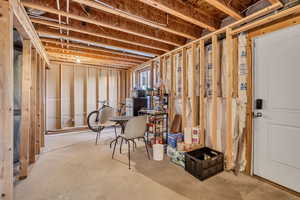Basement featuring freestanding refrigerator