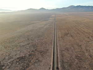 View of mountain backdrop with rural landscape and abundant farmland