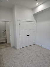 Bedroom featuring a closet, carpet, and recessed lighting
