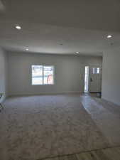 Living room featuring plenty of natural light and recessed lighting
