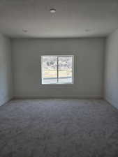 Master Bed room carpeted empty room with a textured ceiling and recessed lighting