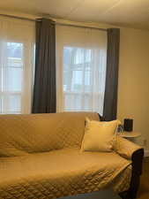 Bedroom with multiple windows