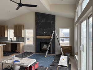 Actual home photo UNDER CONSTRUCTION. Soap Stone tile fireplace surround to ceiling
