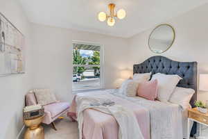 Bedroom featuring baseboards and carpet floors